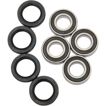 Eight double-sealed ball bearings with black outer and metallic inner rings from the Honda TRX Wheel Bearing Kit Front by Pivot Works are arranged on a white surface, ideal for precise steering control or use as wheel bearings.