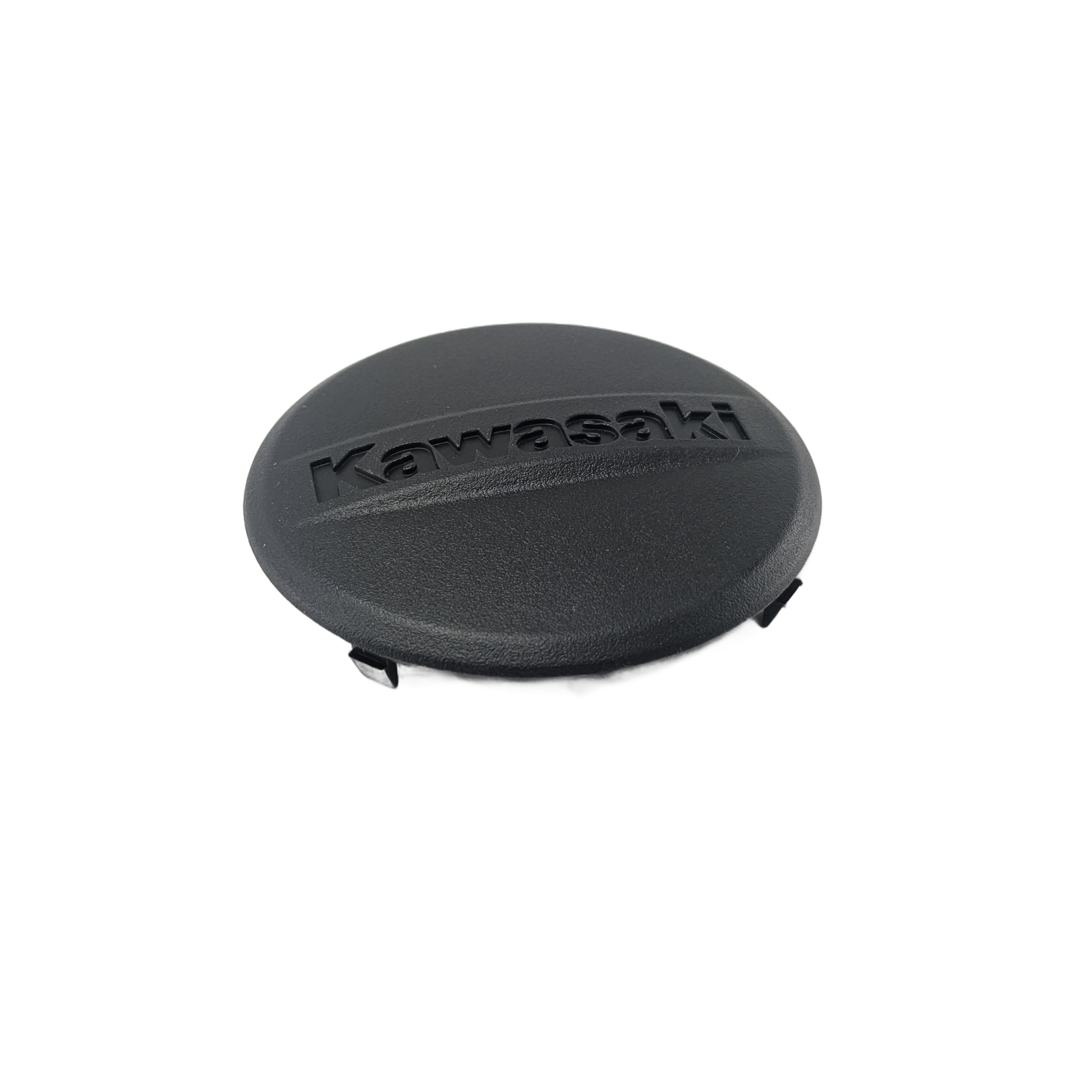 The Cover, Speedometer, F. Black by Kawasaki is a round black plastic OEM protective cover with a textured surface and "Kawasaki" embossed on top, designed for off-road Kawasaki vehicles.