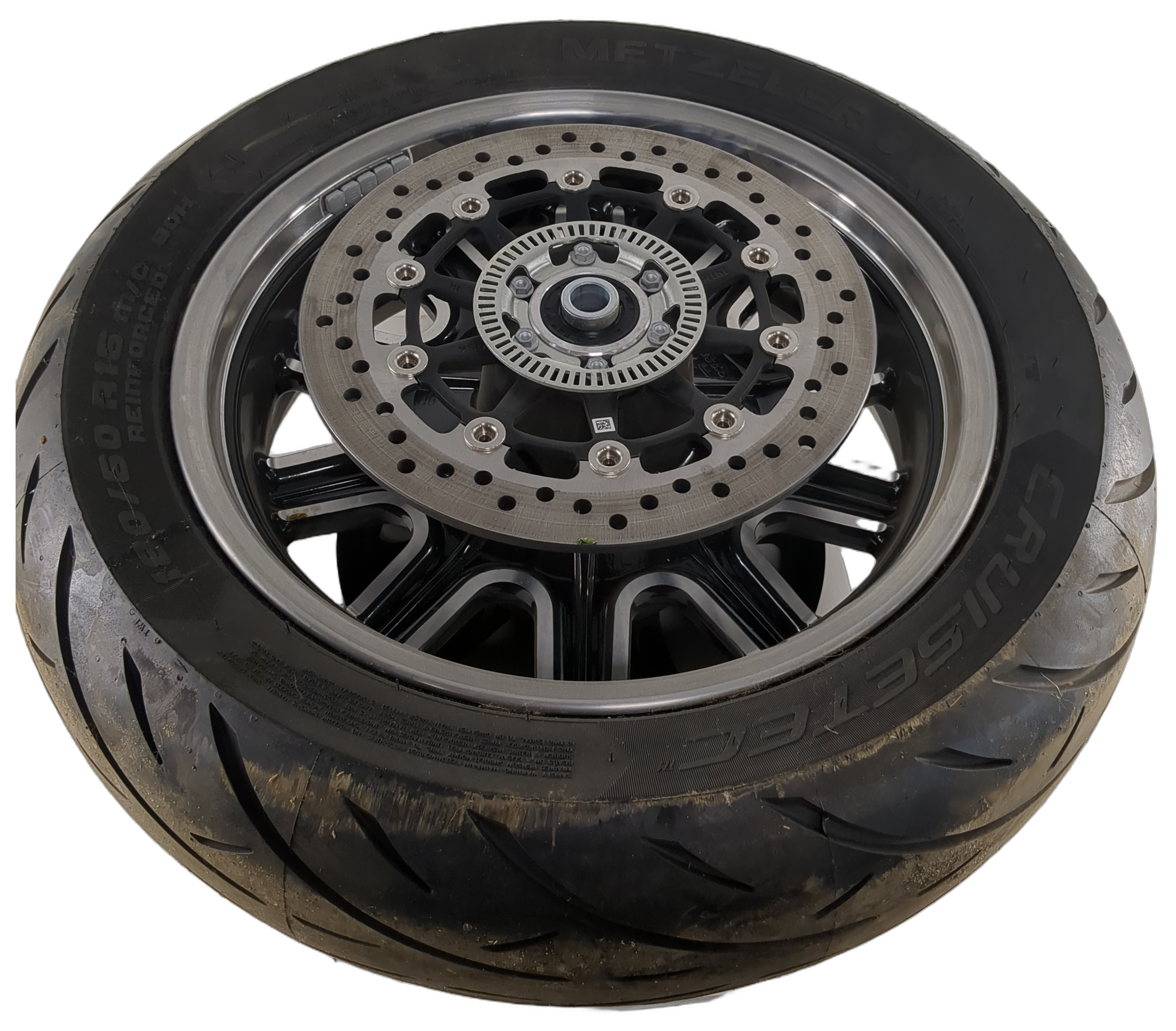 16x5.0 black cast rear motorcycle wheel with Metzeler tire and dual brake rotor.