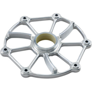 The Cyclone Clutch Cover by Bikeman Performance is a silver, circular billet aluminum component with six slightly curved spokes, a center hole, and six evenly spaced bolt holes. Its polished finish boosts durability and cooling efficiency.