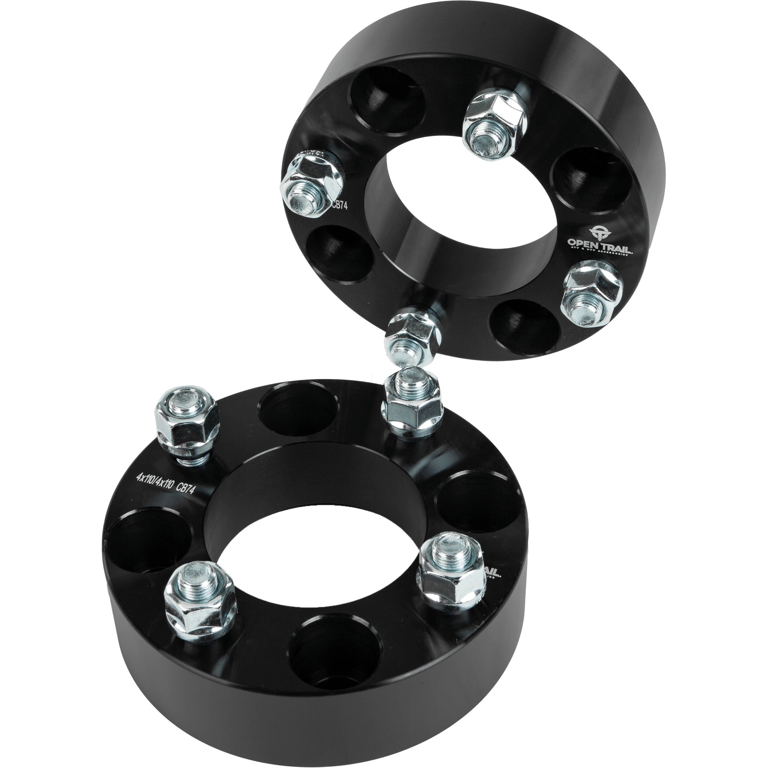 Two Open Trail Wheel Spacer 1.5 4/110 Stud: 12Mm x 1.25Mm are stacked together, one leaning on the other, emphasizing their circular design and bolt layout for enhanced traction and stability.