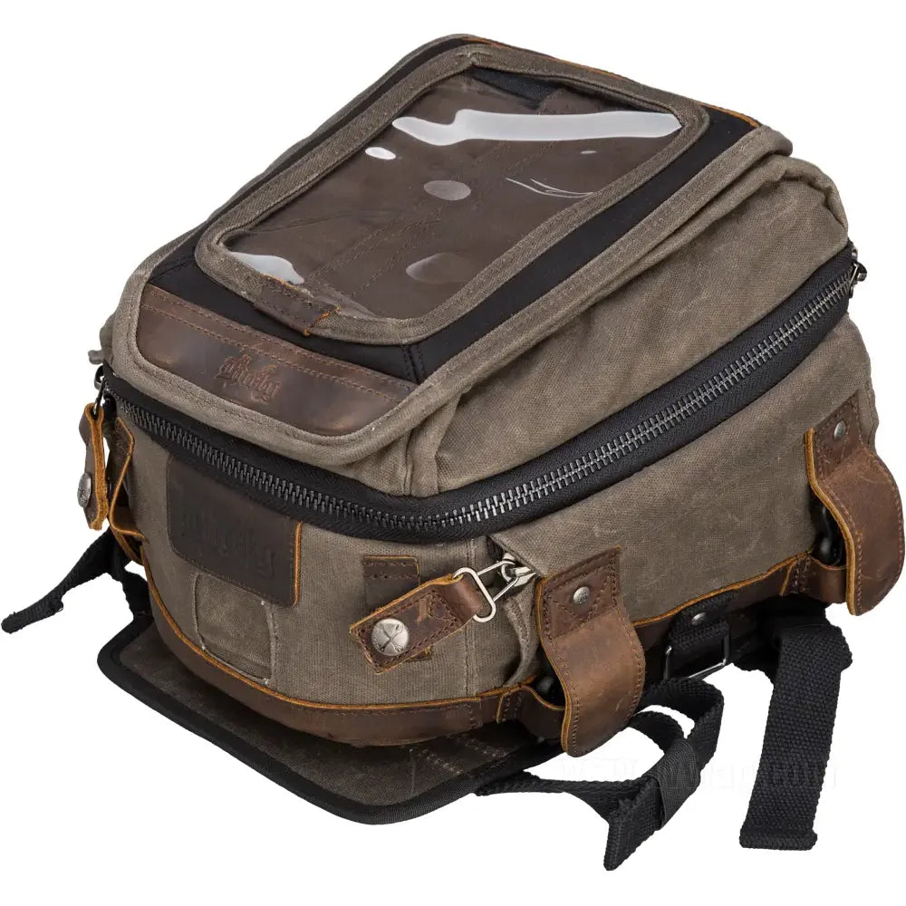 The Tank/Tail Bag by Burly Brand is a rugged brown canvas and leather motorcycle bag with a clear top window, multiple zippered compartments, and sturdy buckles—perfect for durable storage, including your charging accessories.