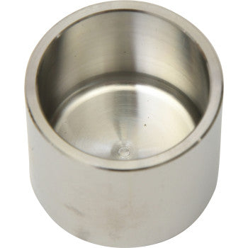 Silver metallic brake caliper piston with smooth cylindrical shape and polished interior surface.