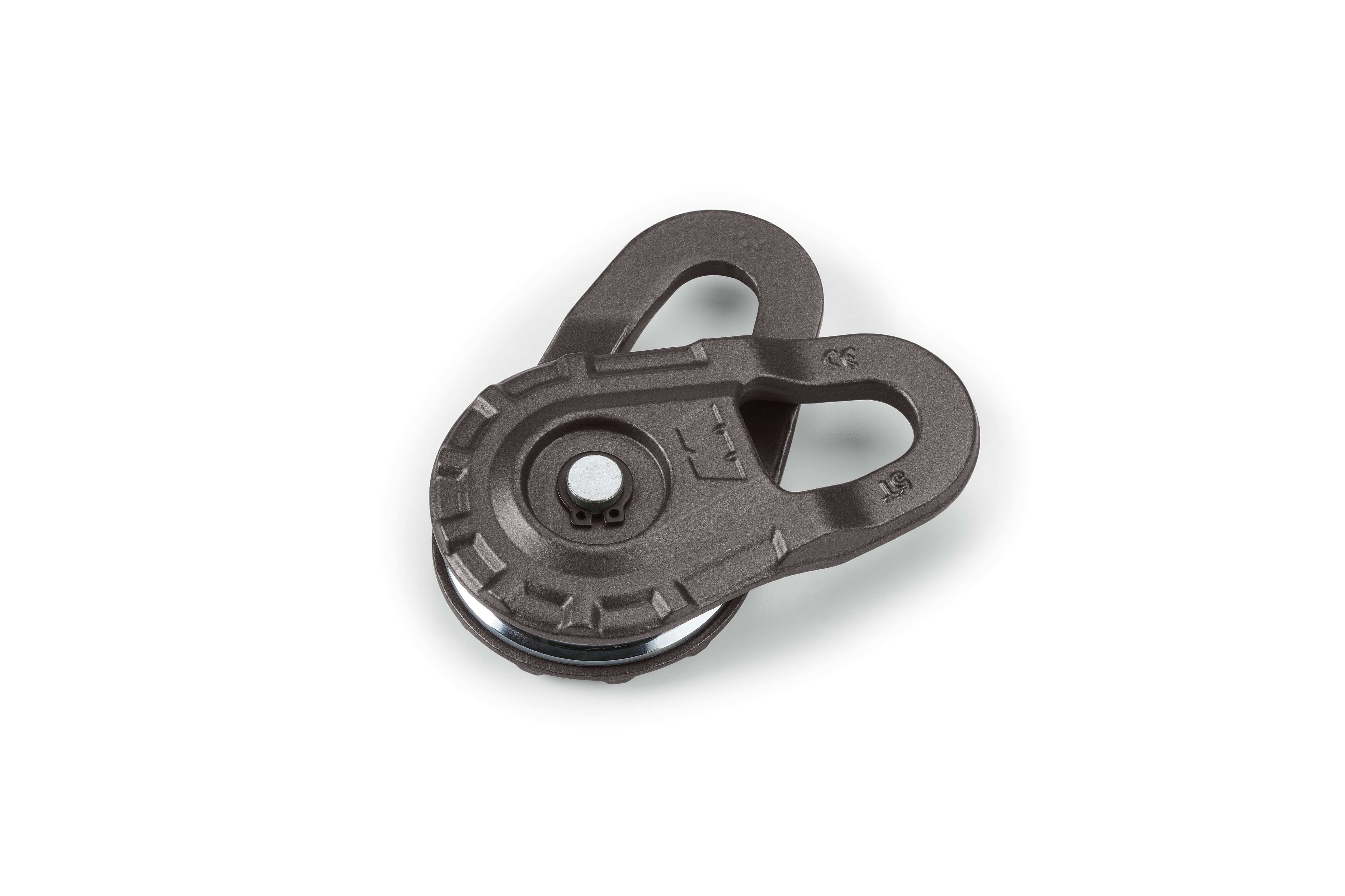 The 5500 lb. Epic Snatch Block by Warn is a black metal pulley with two oval openings at the top and a grooved center wheel, shown on a white background.