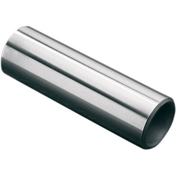 The Wiseco Wrist Pin is a shiny, metallic, cylindrical tube with a smooth surface, shown diagonally on a white background, engineered for lower expansion and greater operating strength through high-tech manufacturing.