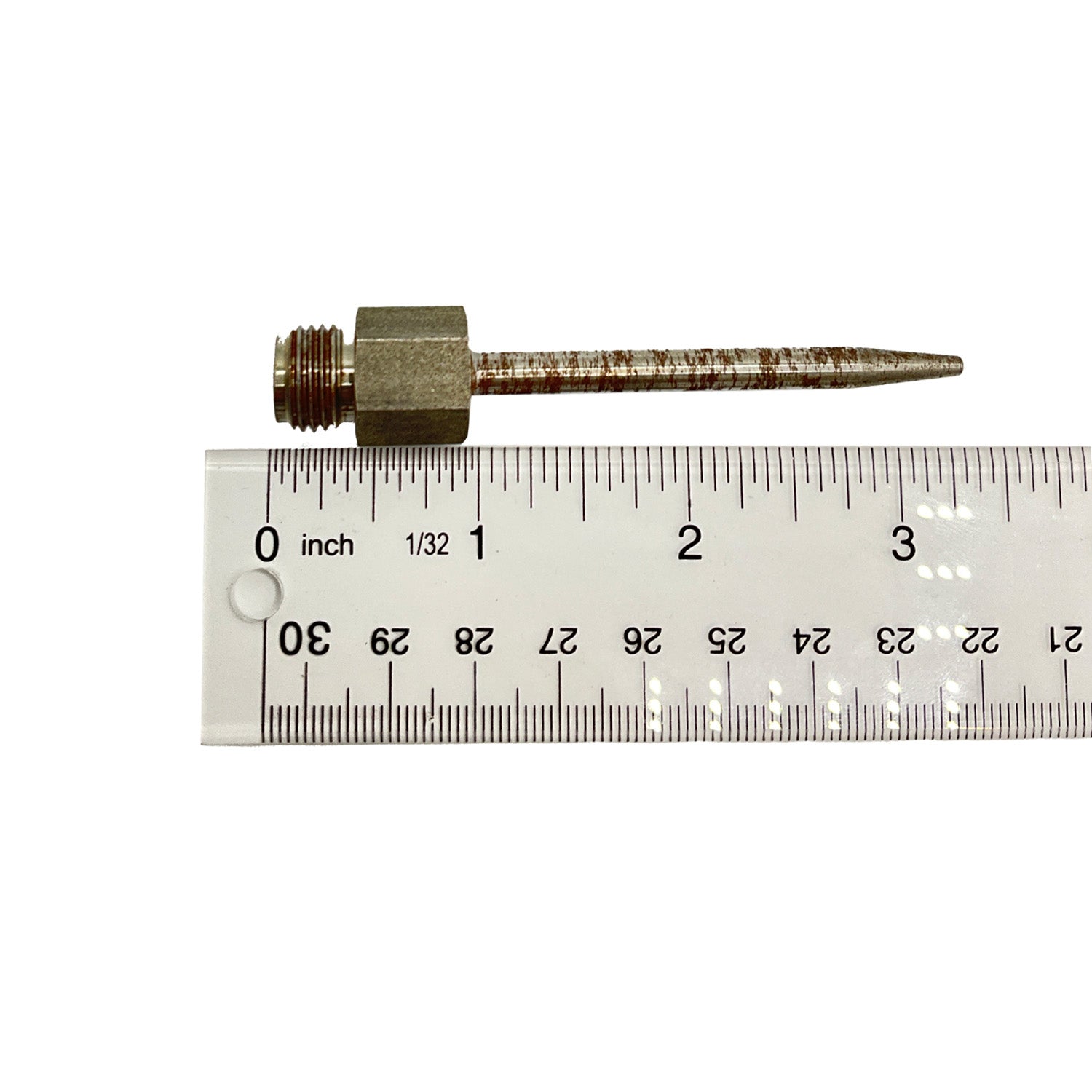 Metal needle with threaded hexagonal brass base next to a clear ruler showing length.
