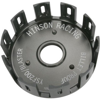 Black anodized circular clutch basket with evenly spaced rectangular tabs and white engraved text reading Hinson Racing and.