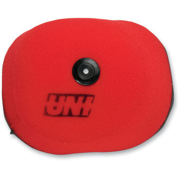 The Air Filter KTM by Uni Filter features a red foam, two-stage design with a black circular center and UNI printed in black. Its rounded, oval shape delivers improved airflow compared to standard OEM filters.