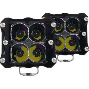 The LED Quattro Light Spot Pair by Heretic features two square lights with four circular CREE LEDs each, black aircraft-grade aluminum housings, silver mounting brackets, and front-corner screws. The lights are shown slightly overlapping.