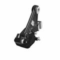 Black metal rear brake caliper bracket with mounting points and silver hardware accents.