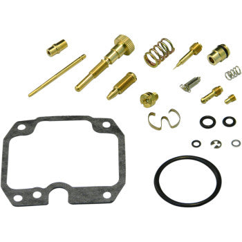 Yamaha carburetor repair kit with brass jets, springs, rubber gaskets, and a black gasket plate.