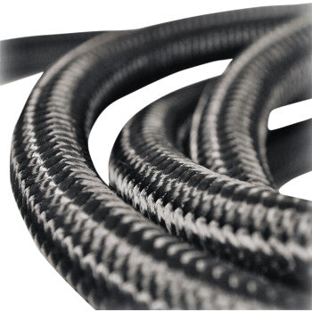 Close-up of several intertwined Fiber Braided Hose - Black - 10 by Jagg Oil Coolers, showcasing their textured, metallic sheen and flexible, durable construction—ideal for oil cooler applications.