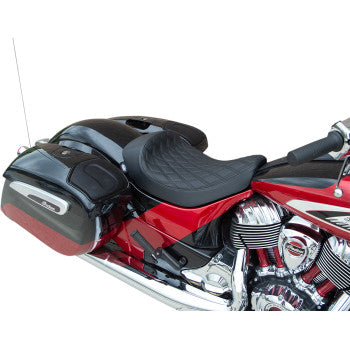 A close-up of a red and black motorcycle with the Indian Solo Seat - Double Diamond - Black Stitching by Drag Specialties, chrome engine, and saddlebags. The quilted black seat fits Indian models from 2014-2022.
