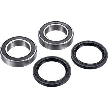 Four circular components from the Axle Bearing Kit Rear by Factory Links—two metal ball bearings with dust seals and two black rubber seals—are arranged on a white background, ideal for off-road wheel bearing replacement.