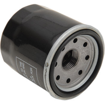 A close-up of the Oil Filter by Parts Unlimited, a black cylindrical filter made with German paper to OEM specs, featuring a threaded center hole and several smaller holes on one end.