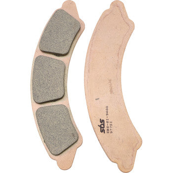 Curved copper-colored metal brake pads with gray sintered friction material segments, SBS branding visible on backing plate.