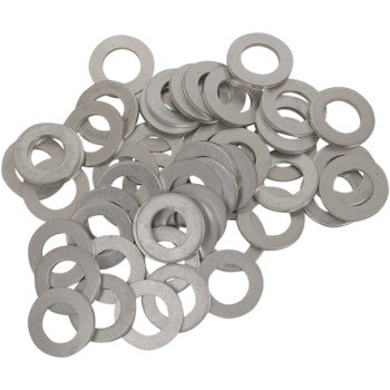 A pile of Bolt Drain Plug Washers M10, each circular with a center hole, scattered on a white surface—perfect as OEM replacement crush washers.
