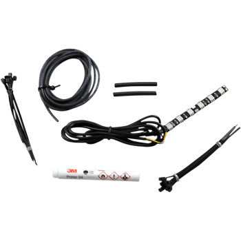The War Bonnet Accent Light - Blue by Custom Dynamics includes a coiled wire, two heat shrink tubes, an LED strip, a 3M primer marker, and cables with connectors, all shown on a white background.