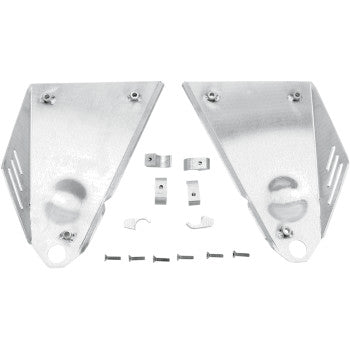 Two silver Fat Series A-Arm Guards by Dg Performance, made from aircraft aluminum with rounded edges, lie side by side. Below them, several small brackets and screws are arranged—perfect for suspension protection.
