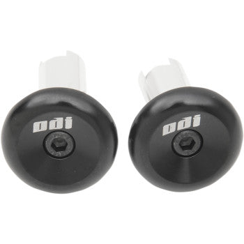Black aluminum handlebar end plugs with Odi logo and central hex bolt screws.