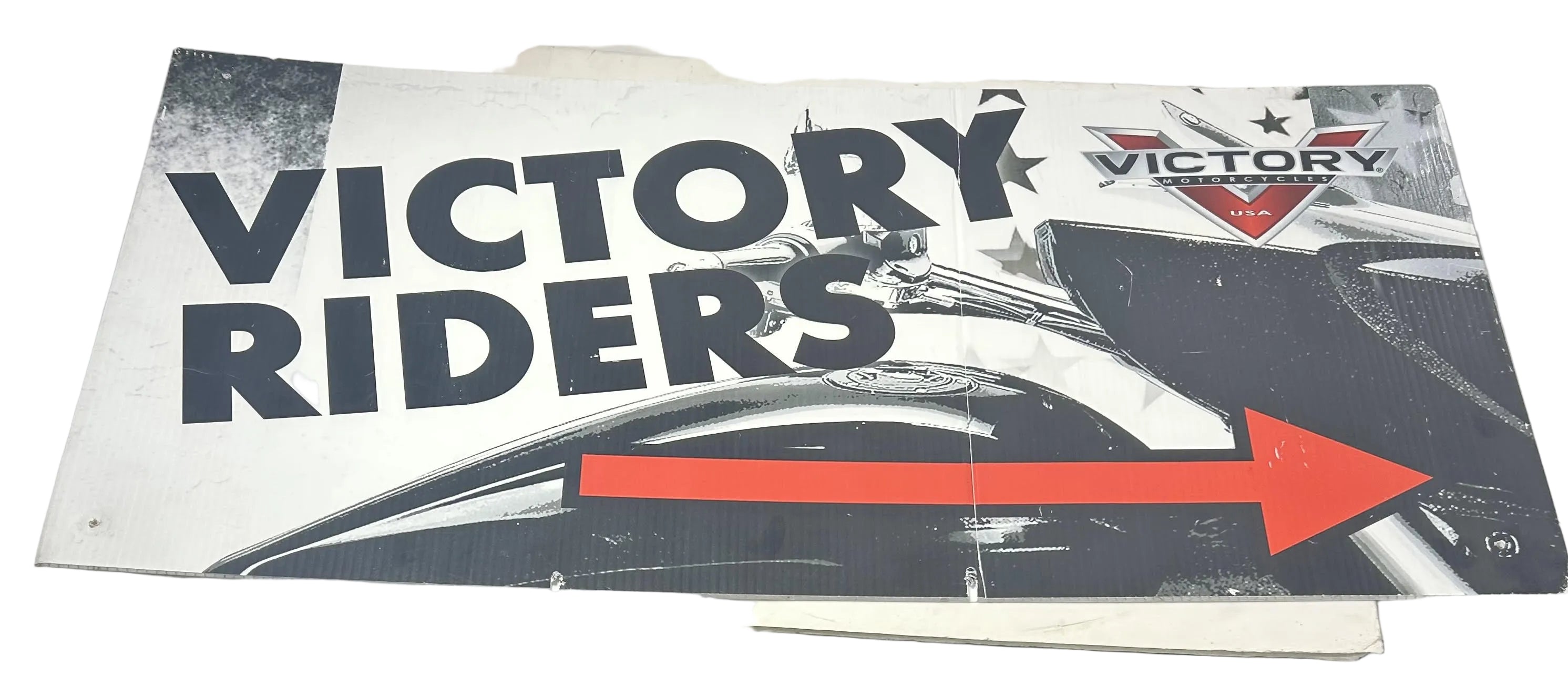 Rectangular Victory Riders banner with bold black lettering, a red-and-black arrow, and a motorcycle graphic on a white.