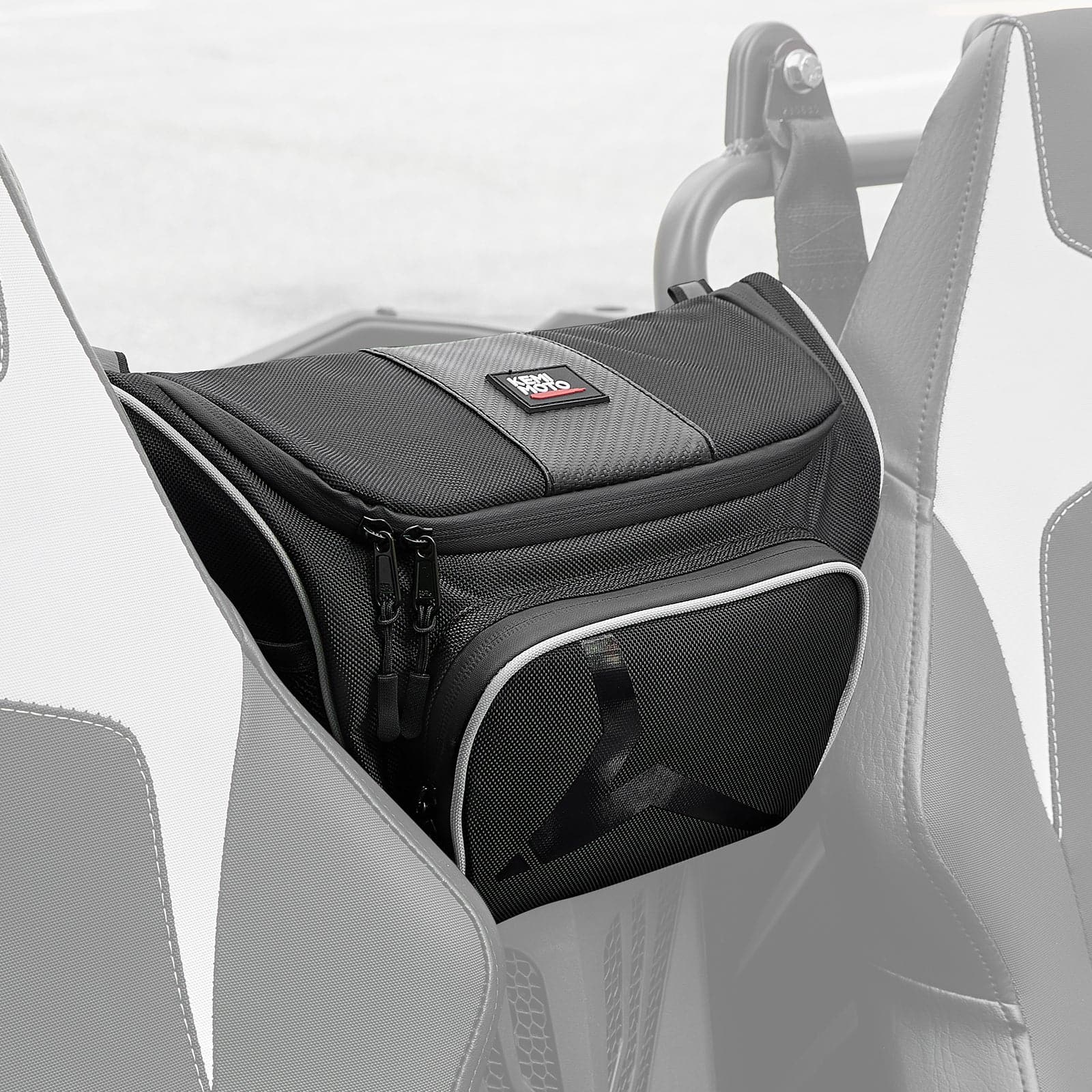 The CFMOTO ZForce 500/800/1000 Storage Bag by Kemimoto features durable 1680D fabric, zippers, mesh pockets, a top patch, and light trim. It attaches between two seats with a black rectangular design, standing out against the grayscale background.