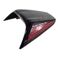 The Asm-Cowl Seat Cf/Grfx by Polaris, shown on a white background, features black carbon fiber with a bold red side accent.