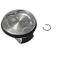 A shiny metal piston assembly with a flat top surface and a circular retaining clip on the right, set against a white background—Assembly, Piston [Incl. Rings, Pin, Ret. Rings] by Polaris, an essential OEM part for your Victory motorcycle.