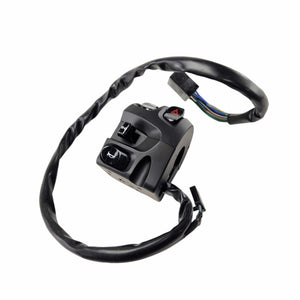 A black Switch, Control, Lh by Polaris for Victory motorcycles, featuring buttons and a wired connector, with the wiring coiled around the switch assembly and displayed against a white background.
