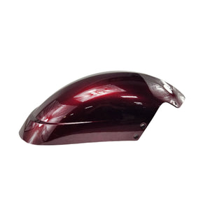 A glossy, dark red Polaris Fender, Front, Front Half [IntL] with a metallic finish is displayed against a white background. Its curved shape and OEM Victory Polaris parts bolt holes reflect light on the smooth surface.
