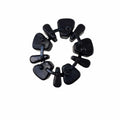 The Puck-Cushdr Left Nr by Polaris is a black circular mechanical coupling with eight interlocking segments, shown isolated on a white background.