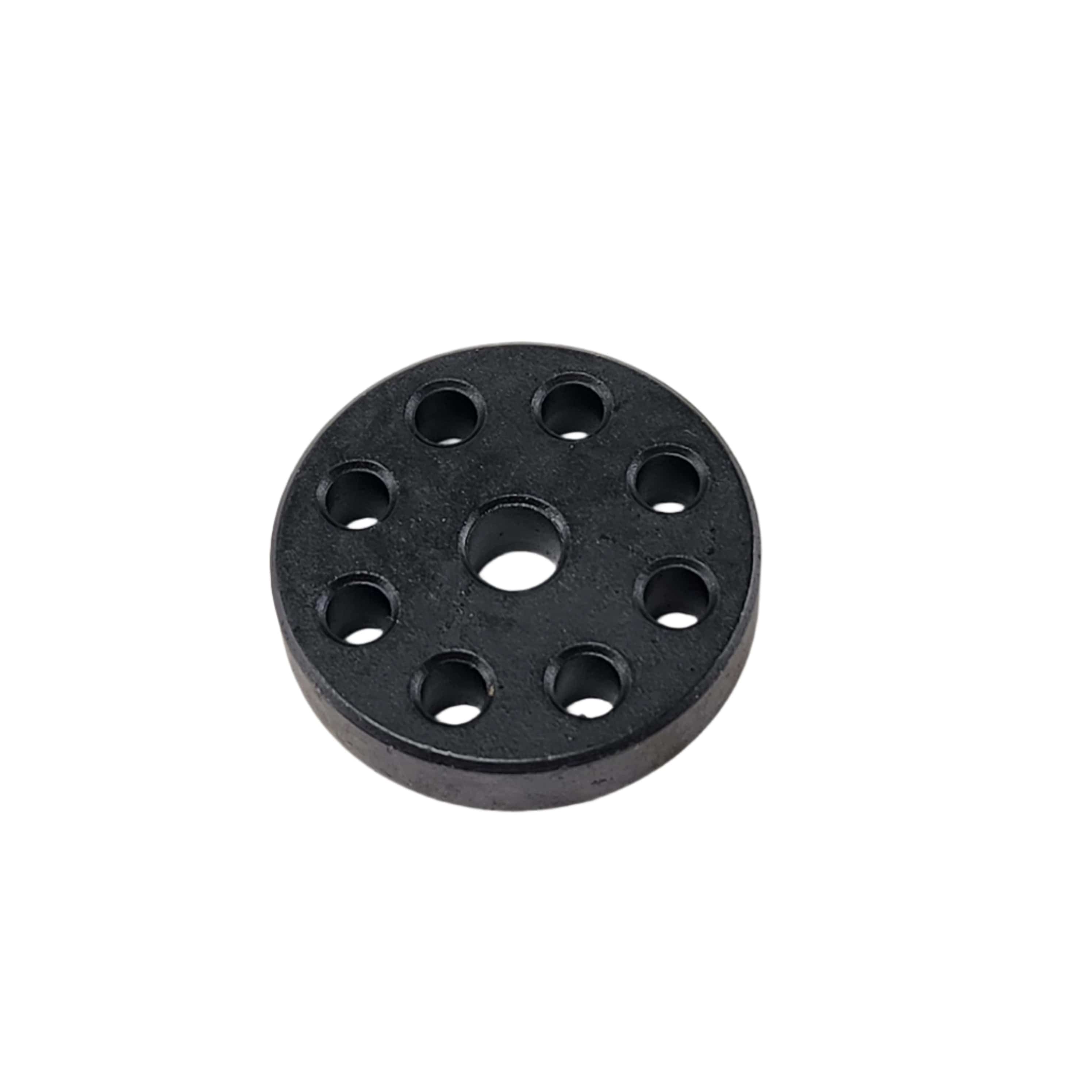A black circular disc with a central hole and seven evenly spaced holes, resembling a Spacer 7.5Mmx24Mm M6 by Polaris, is placed on a white background.
