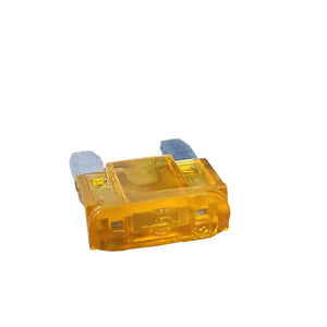 A close-up photo of a yellow Fuse, 5 Amp by Polaris with two metal prongs, commonly used as an OEM part for Victory motorcycles, isolated on a white background.