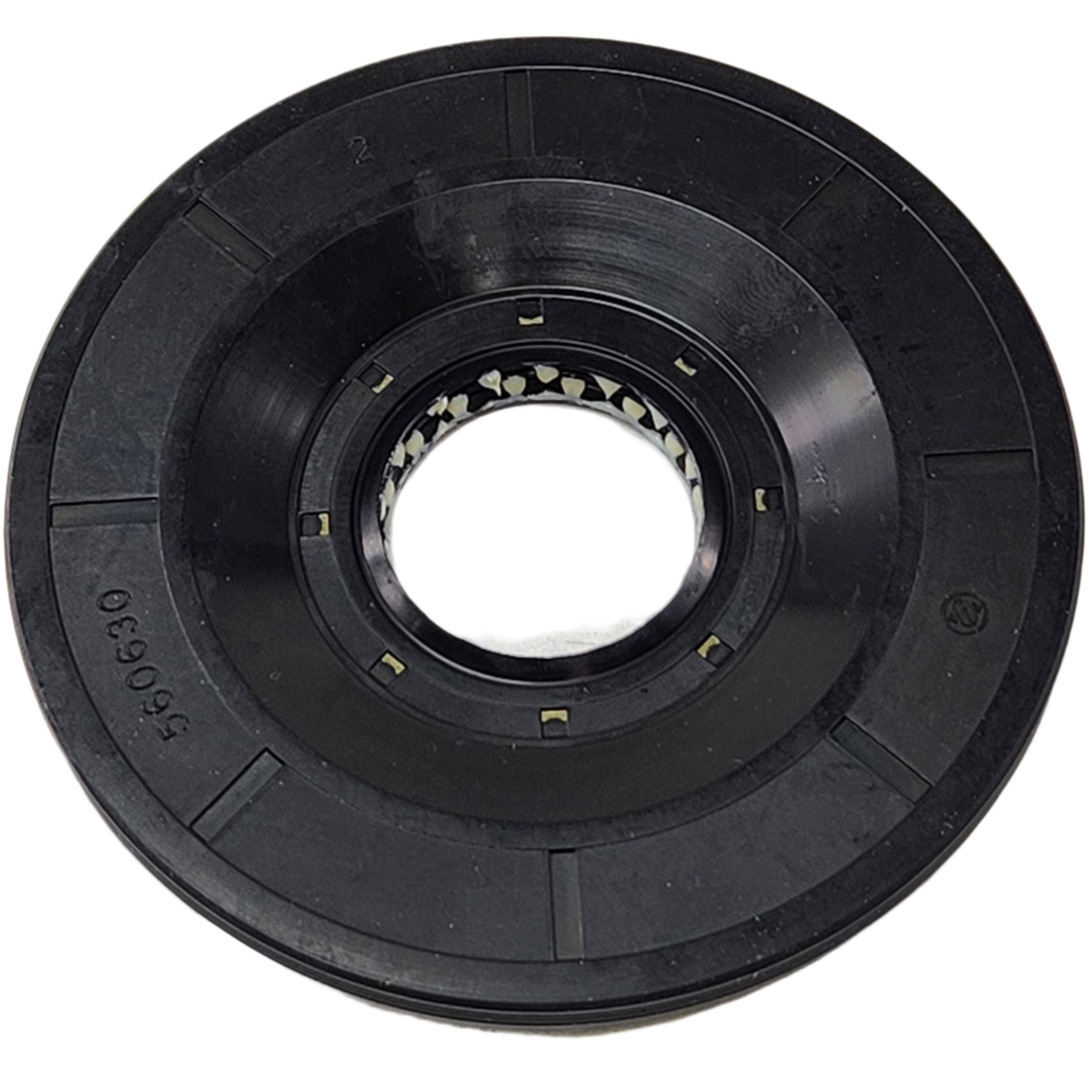 A close-up photo of a black plastic reel with a hollow center, featuring small rectangular holes inside the central ring. This part is the Seal by Can-Am, suitable as an OEM component for various mechanical or electronic devices.