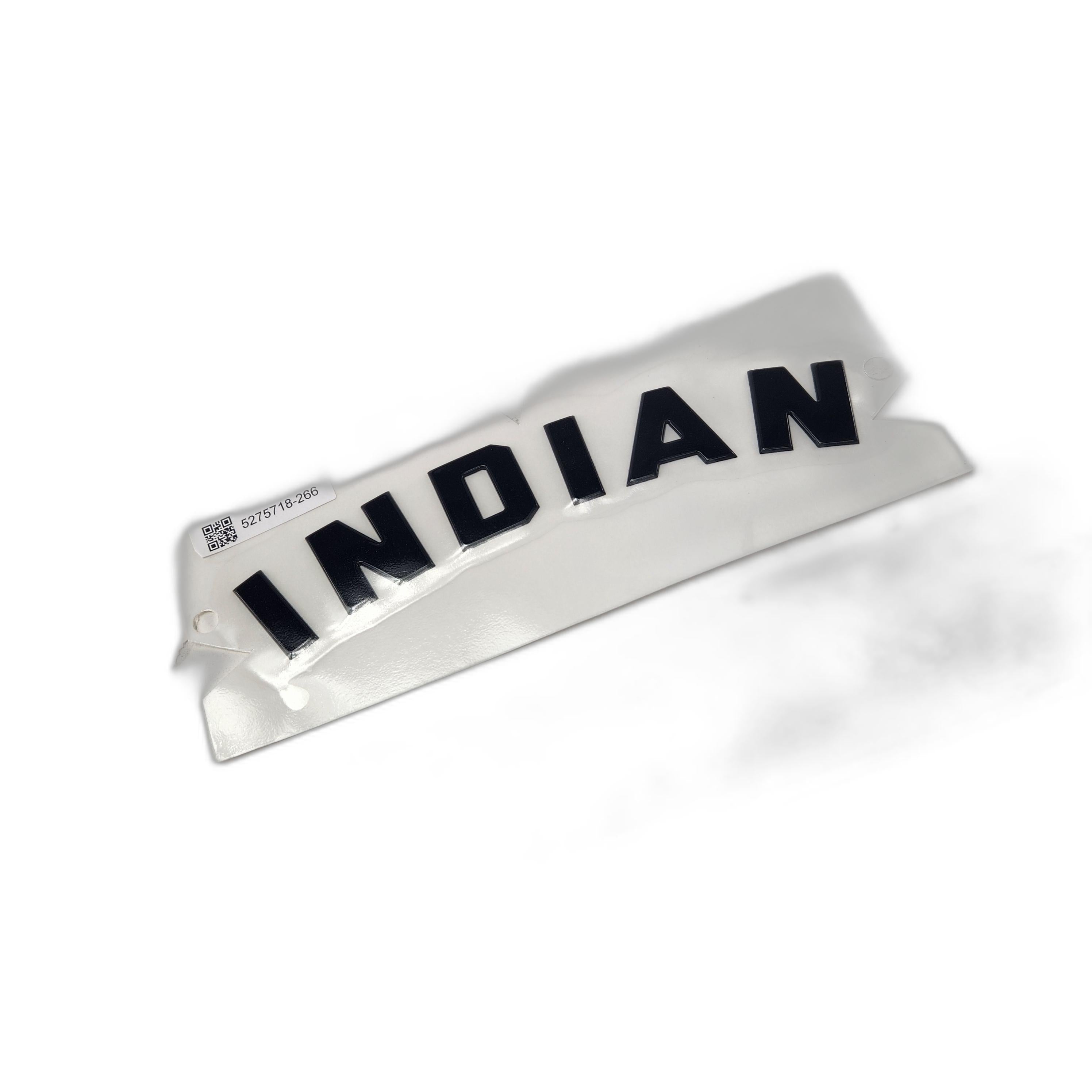 A white sticker with INDIAN in bold black block letters, curved like a Polaris Indian motorcycle badge. Features a small QR code and serial number in the upper left corner. Product: Badge Tank 999 Block Black by Polaris.