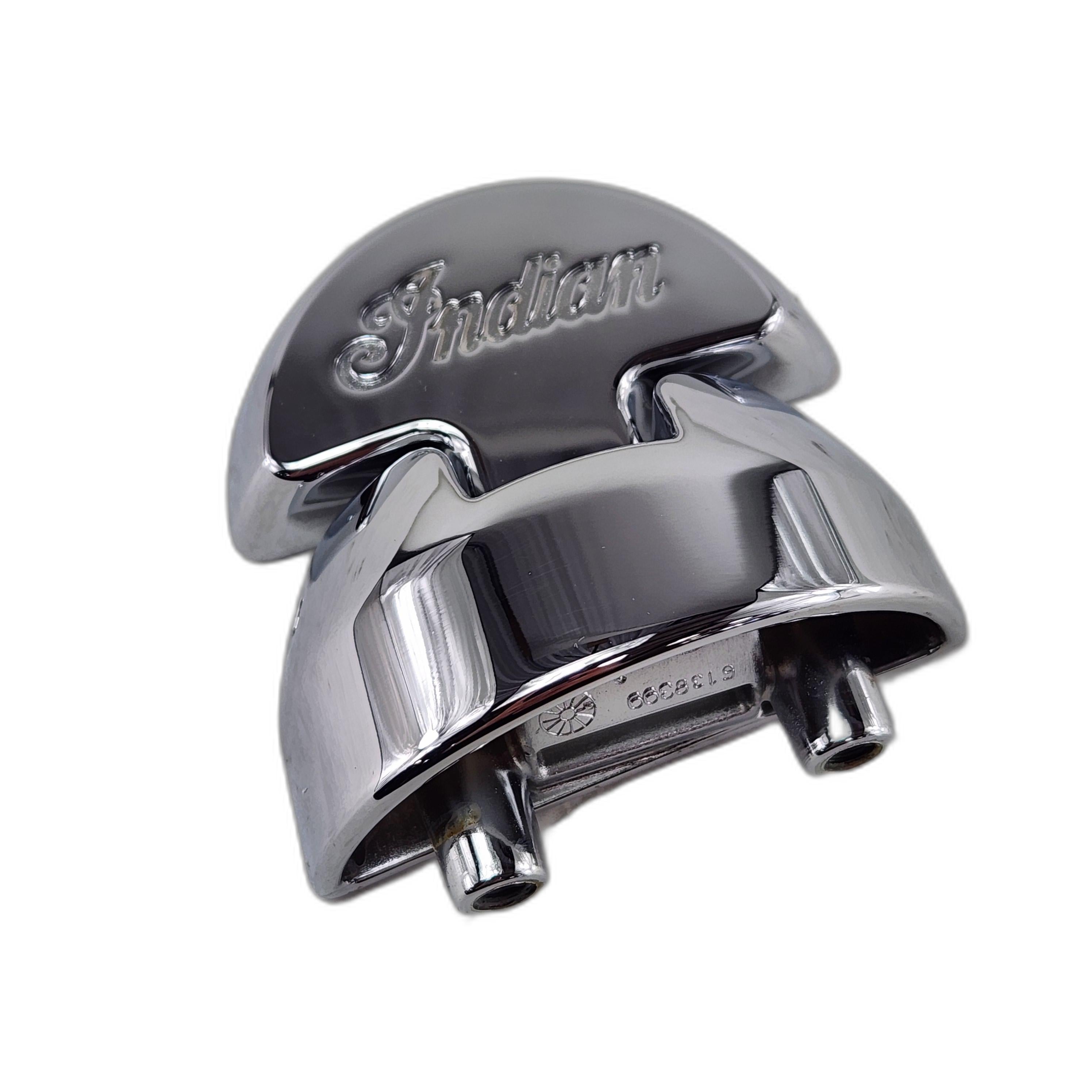 The Assembly Hinge Saddlebag Front Chrome by Polaris features Indian engraved on top and two cylindrical connectors below. Photographed on a white background, its an authentic OEM part for Indian motorcycle enthusiasts and collectors.
