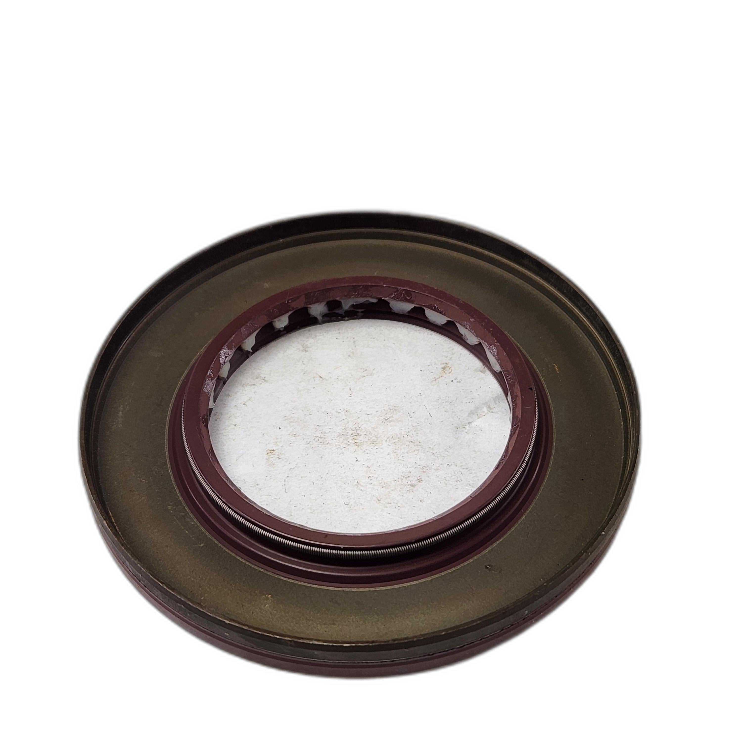 A Seal By Arctic Cat, featuring a round metallic design with a brownish outer ring and transparent center, is shown on a plain white background.