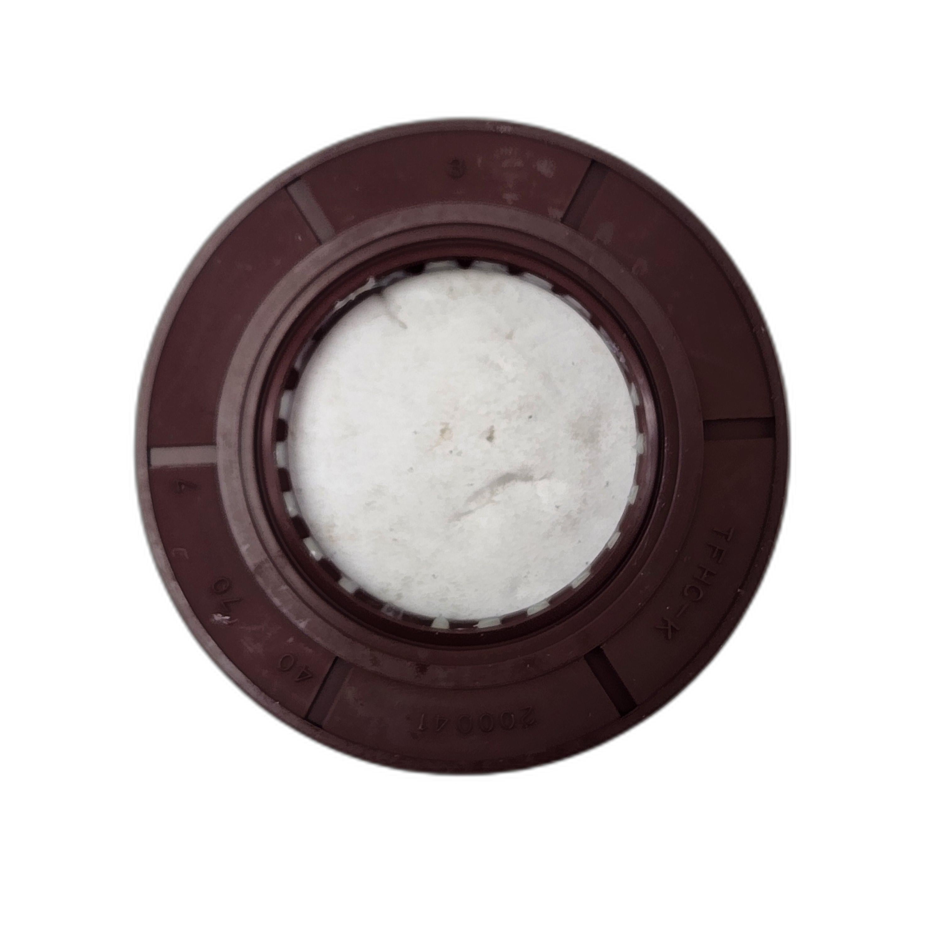 A round brown plastic Seal By Arctic Cat with a white textured center, shown from above on a white background—perfect as a replacement part for Arctic Cat OEM or any compatible UTV accessory.