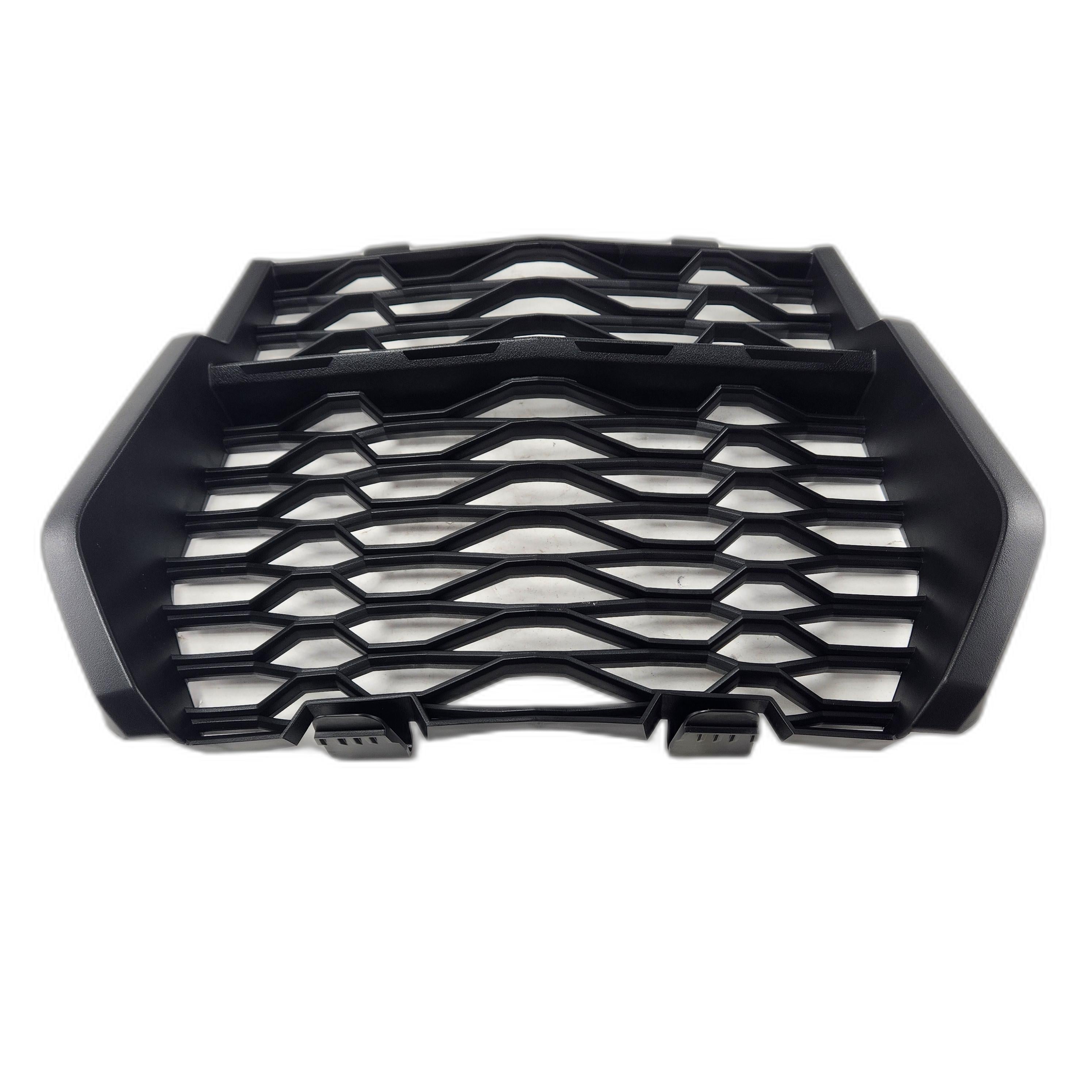 The Cover,Fr Grill by Kawasaki is a black, angular car grille with a geometric honeycomb pattern, thick edges, and intersecting bars—precision crafted to match the quality of Kawasaki OEM parts. Seen from above on a white background.