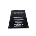 A black 2013 Owners Manual for Polaris Victory Cross Country/Cross Roads, perfect for finding OEM parts. Shown on a white surface.