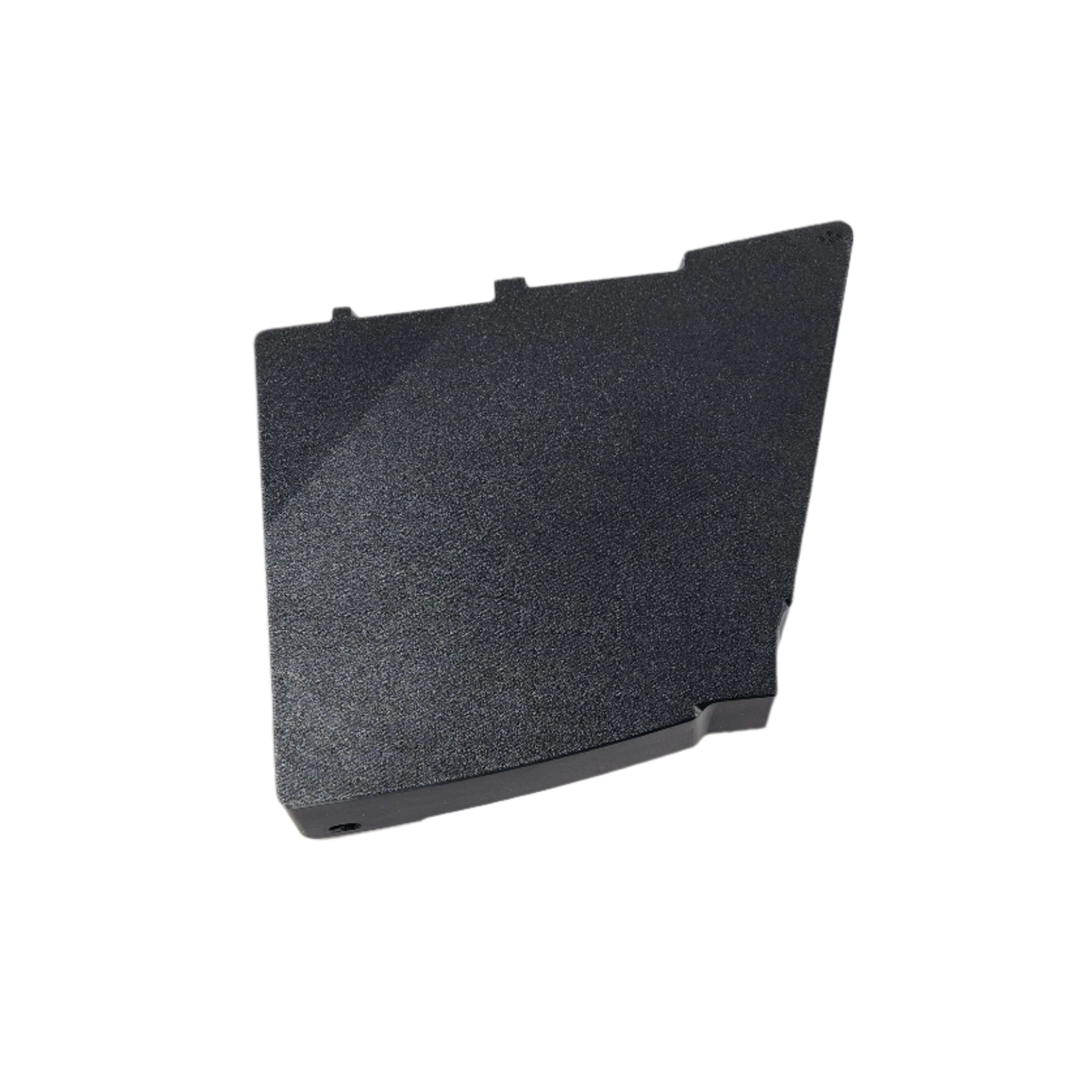 A dark gray, irregular Saddlebag Organizer Tray by Disruptive Misfit Solutions sits on a white surface. With angled edges and a textured finish, its perfect for organizing your Victory Cross Country motorcycle storage.