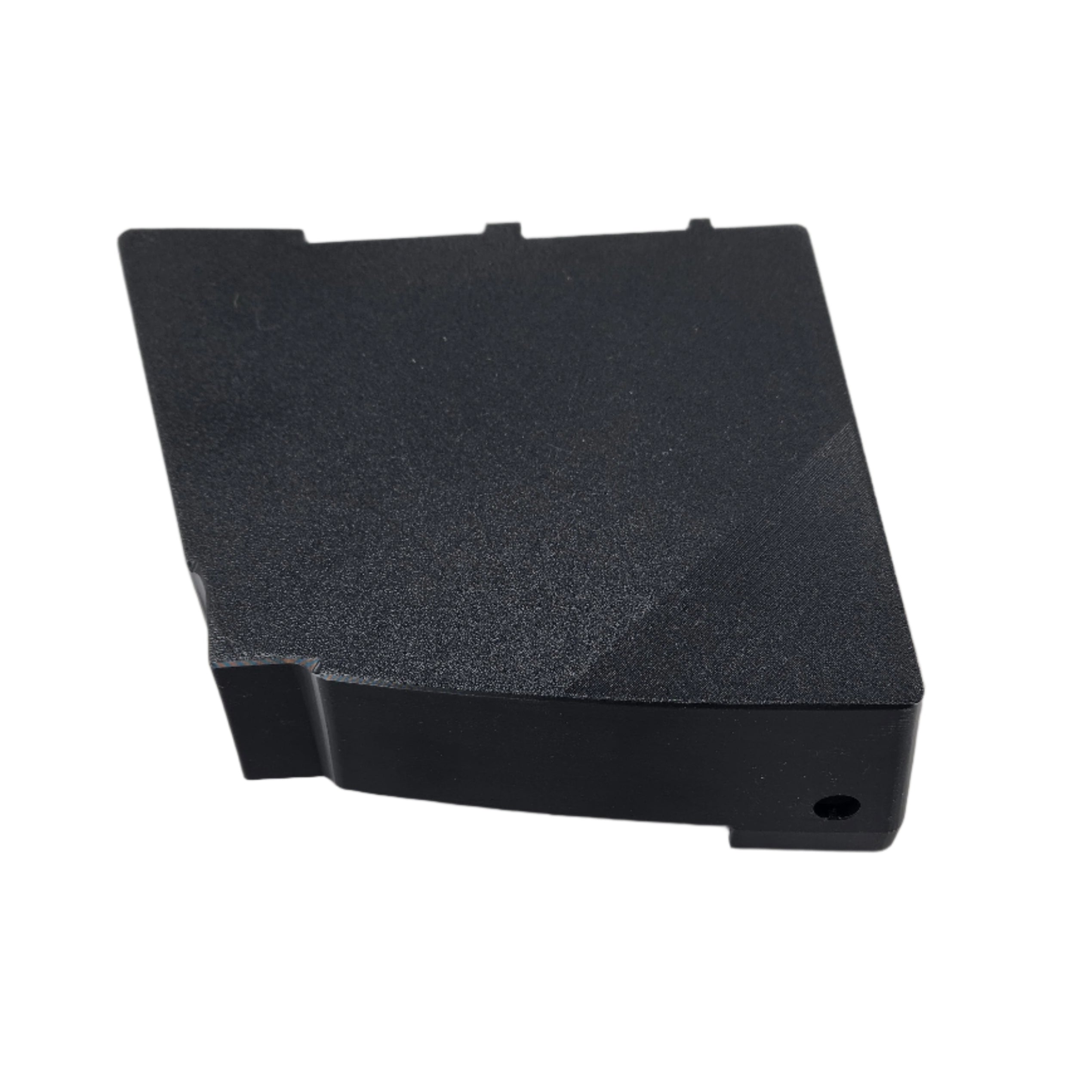 The Saddlebag Organizer Tray by Disruptive Misfit Solutions is a black, rectangular plastic cover with a textured surface, small hole on one edge, and top notches—perfect for Victory Cross Country motorcycle storage.