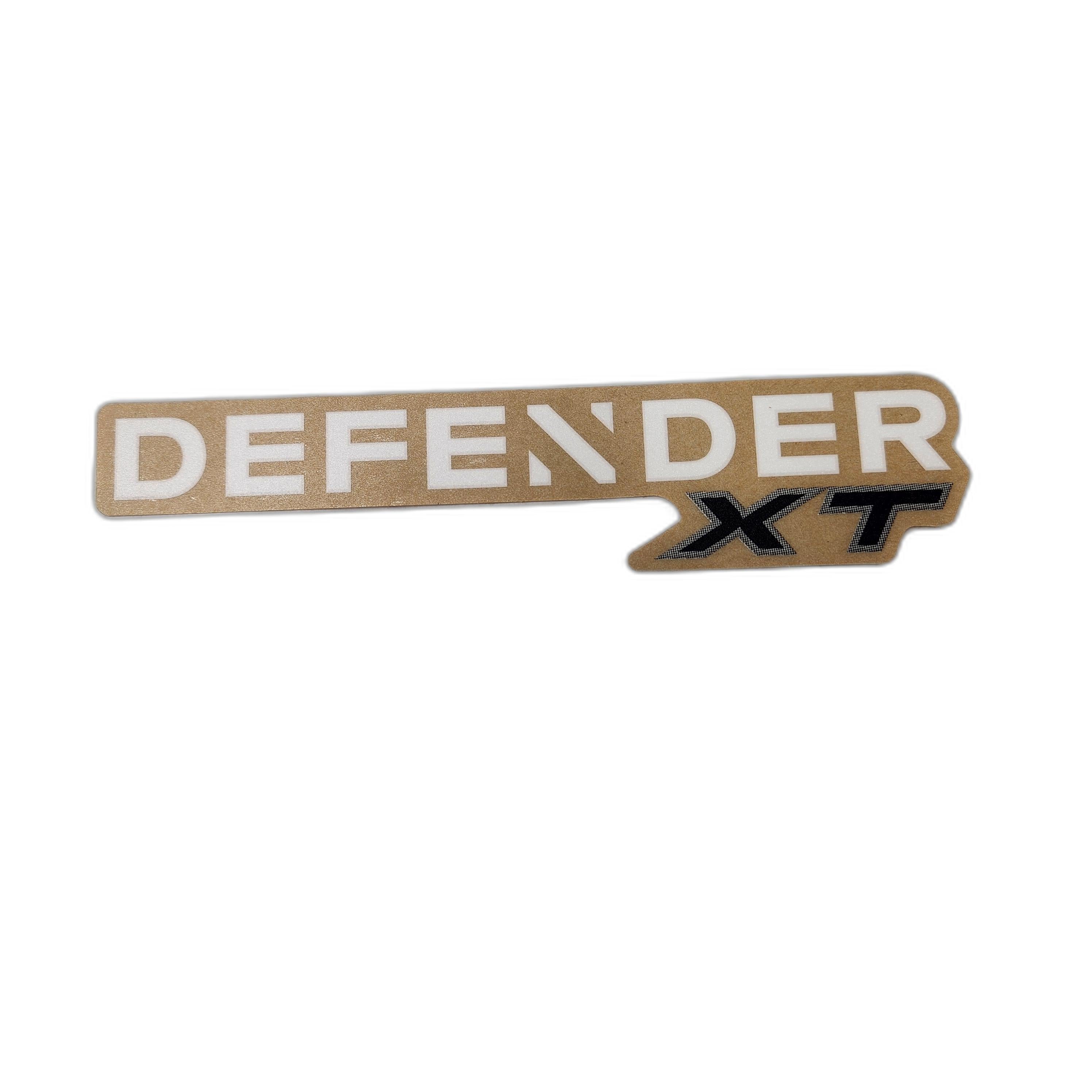 The Lateral Decal Defender XT by Can-Am features bold white DEFENDER and black XT on a gold arrow background—ideal for customizing your ride with genuine Can-Am ATV or OEM parts.