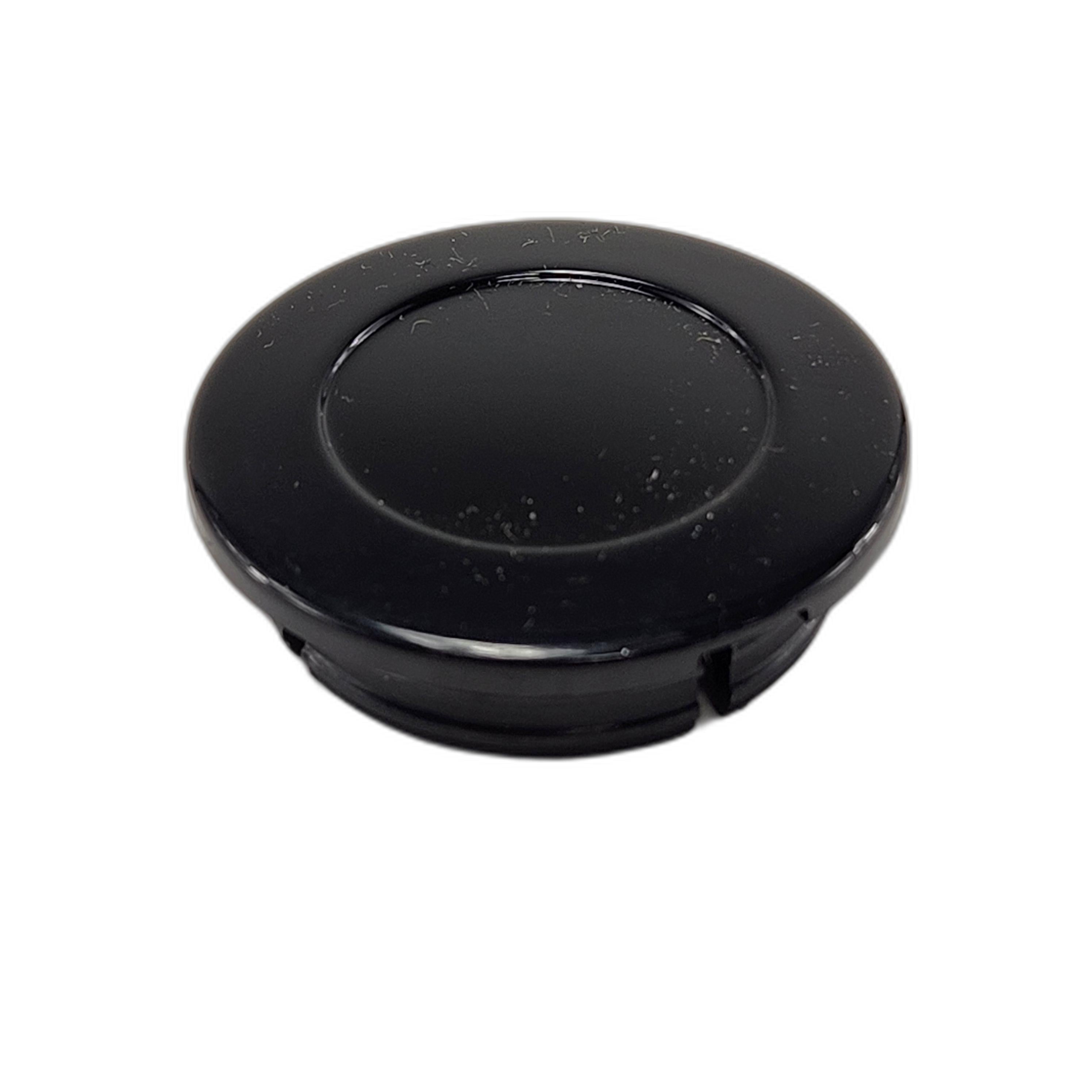 The Cap, Swing Arm Pivot by Polaris is a round black plastic cap with a smooth finish, designed as an OEM part for Polaris motorcycles, shown against a plain white background.