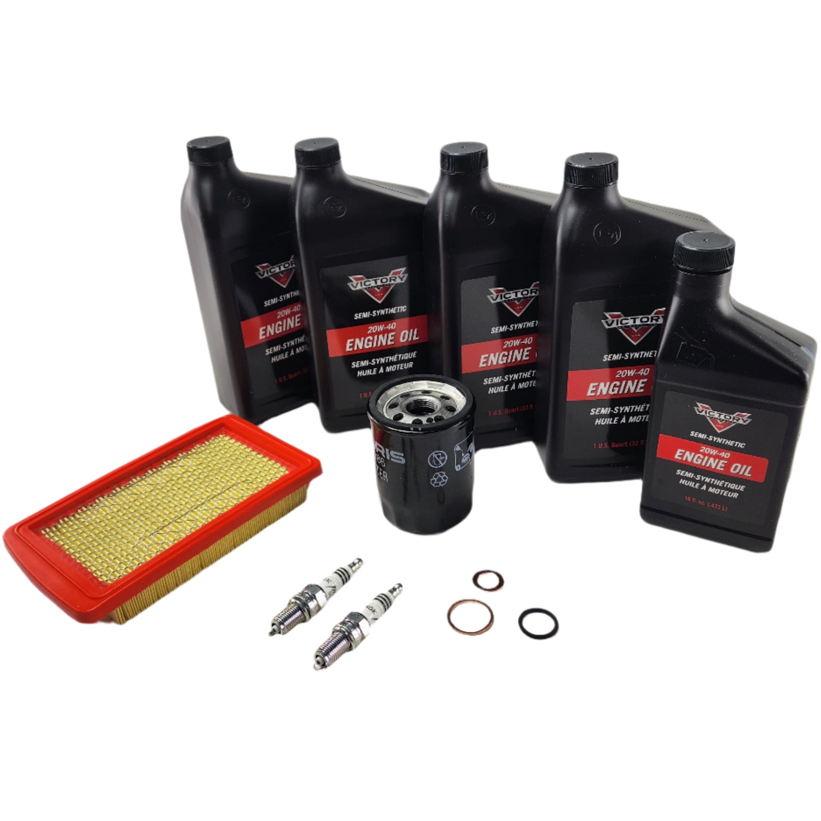 The Motorcycle Maintenance Kit for Victory Steel Frames 2008-UP by Witchdoctors, featuring five engine oil bottles, an air filter, an oil filter, two spark plugs, and two small round gaskets, is displayed on a white background.