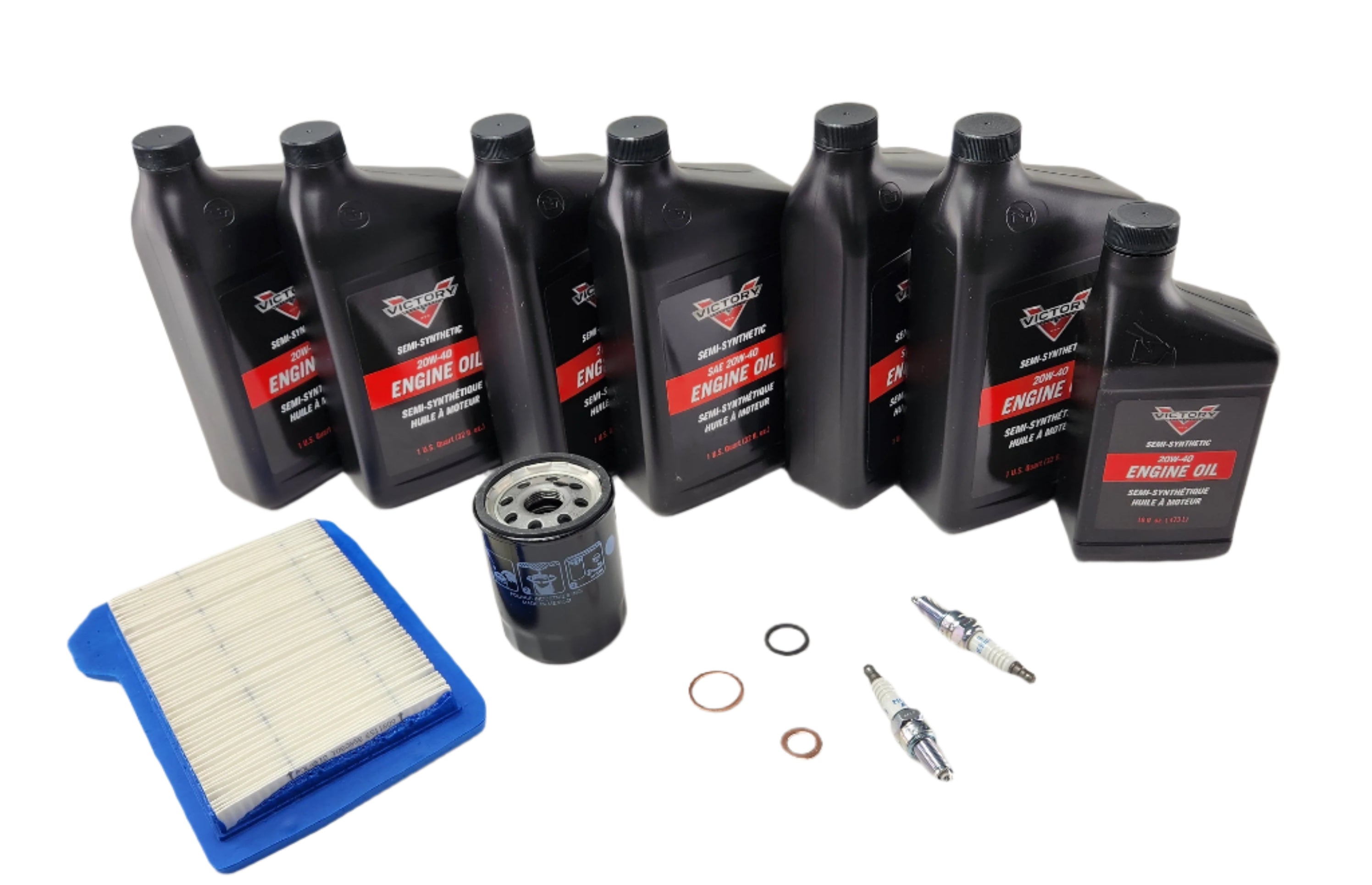The Motorcycle Maintenance Kit for Victory V92 by Witchdoctors includes six engine oil bottles, an air filter, an oil filter, two spark plugs, plus washers and rings—everything needed for comprehensive motorcycle maintenance.