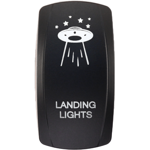 A black Dash Switch Rocker Face by XTC Power features a white UFO graphic beaming light, with stars around it and LANDING LIGHTS printed below in white.