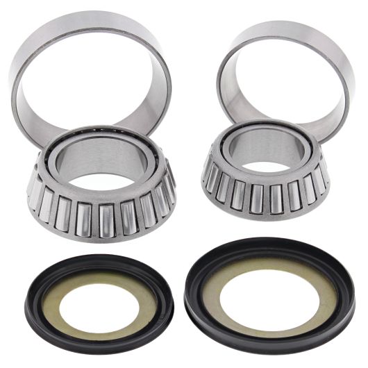 Set of four silver metal tapered roller bearings and matching black rubber seals for motorcycle steering stem.