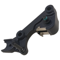 Matte black front brake caliper bracket with mounting points and integrated metal clip.