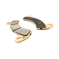 Copper-colored metal brake pads with segmented gray friction material for Polaris offroad vehicles.